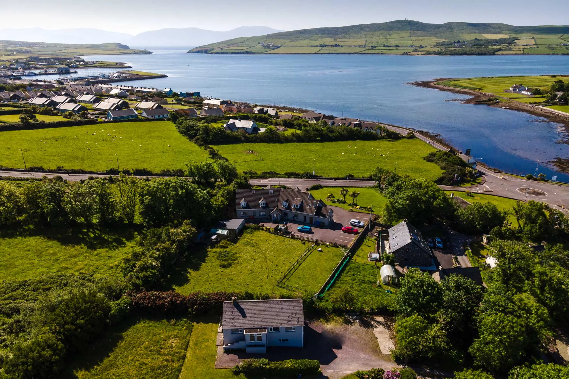 Aerial view of Milltown Cottage overlooking Dingle Bay and the surrounding hills