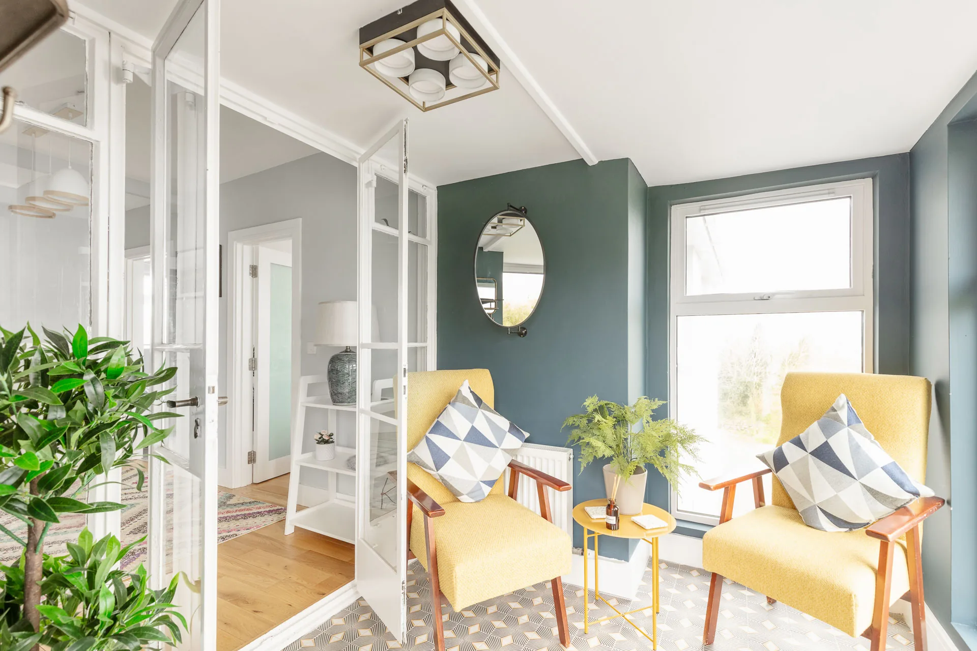 Sunny reading nook with yellow armchairs