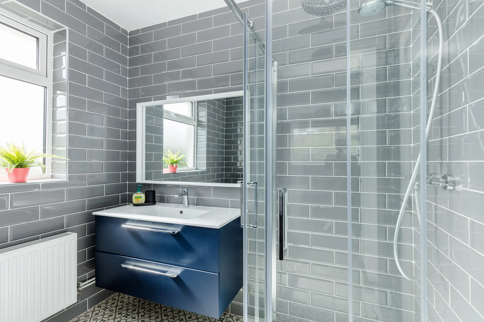 Grey tiled ensuite shower room